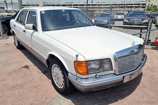 Image of a pre-owned 1987 white Mercedes-Benz S560 car