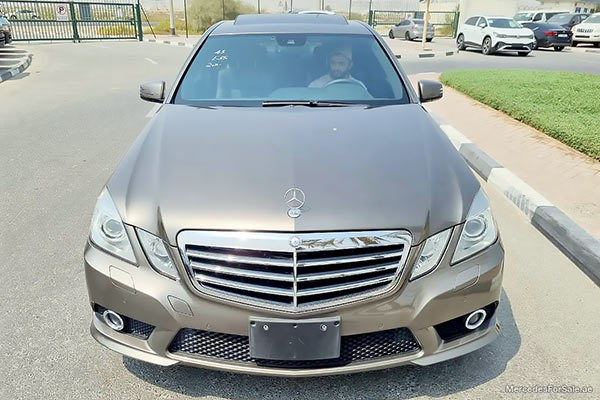 Image of a pre-owned 2010 gold Mercedes-Benz E550 car
