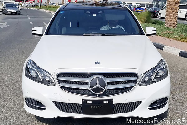 Image of a pre-owned 2016 white Mercedes-Benz E400 car